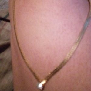 24k gold necklace with a diamond. And a cancer awa